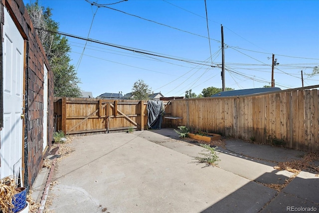 view of patio / terrace with a gate and fence