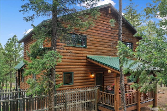 2255 Spruce Rd, Woodland Park, CO 80863 - view of property exterior with a deck and log exterior