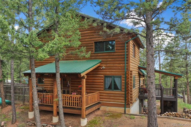 2255 Spruce Rd, Woodland Park, CO 80863 - back of house with a wooden deck and a metal roof