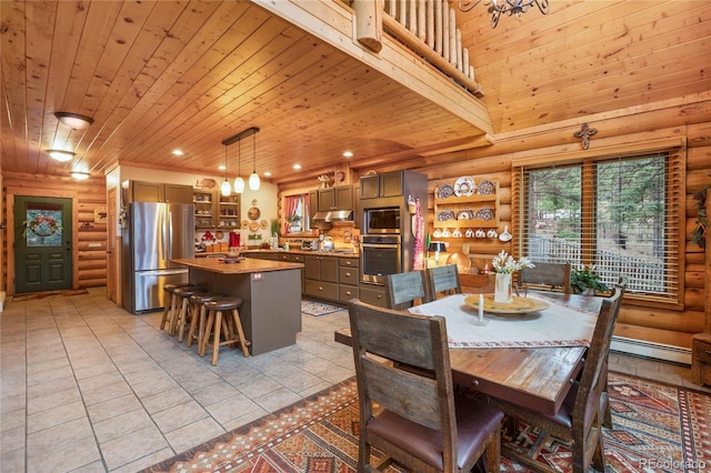 2255 Spruce Rd, Woodland Park, CO 80863 - dining space with log walls, a baseboard heating unit, wood ceiling, light tile patterned floors, and recessed lighting