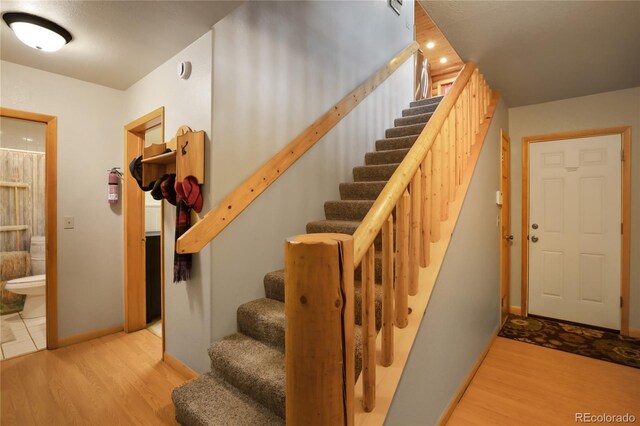 2255 Spruce Rd, Woodland Park, CO 80863 - stairs featuring wood finished floors