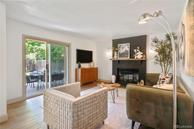 10016 Teton Ct, Lone Tree, CO 80124 - living room with a brick fireplace and light wood-style floors