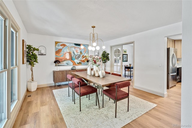 10016 Teton Ct, Lone Tree, CO 80124 - dining area featuring light wood-style floors and a chandelier