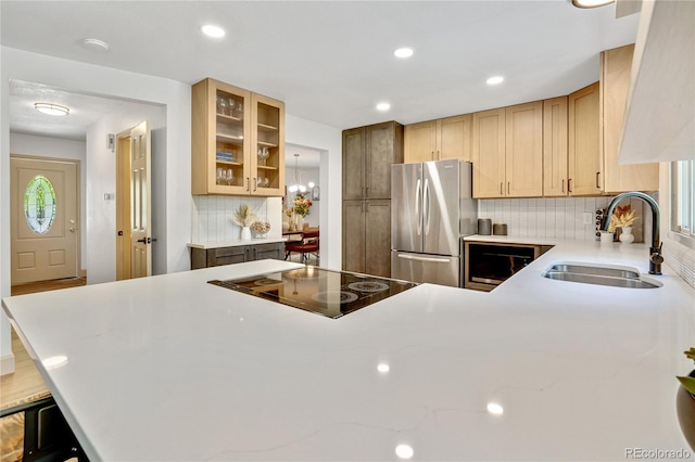 10016 Teton Ct, Lone Tree, CO 80124 - kitchen featuring freestanding refrigerator, black electric cooktop, tasteful backsplash, glass insert cabinets, and recessed lighting