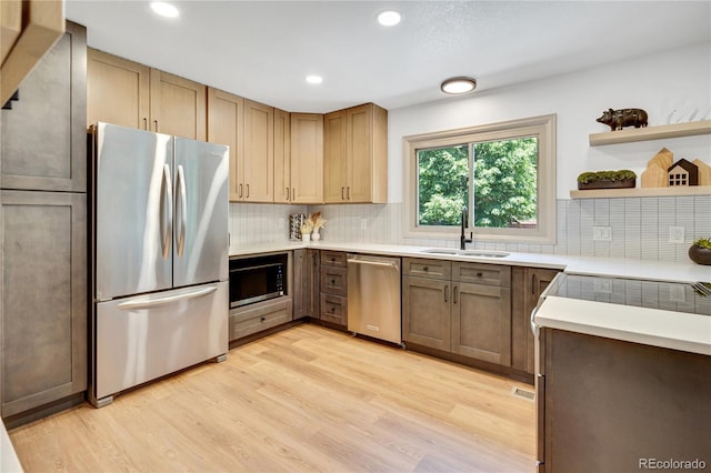 10016 Teton Ct, Lone Tree, CO 80124 - kitchen with appliances with stainless steel finishes, decorative backsplash, light wood-type flooring, recessed lighting, and light countertops