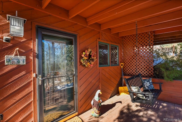 property entrance featuring a deck