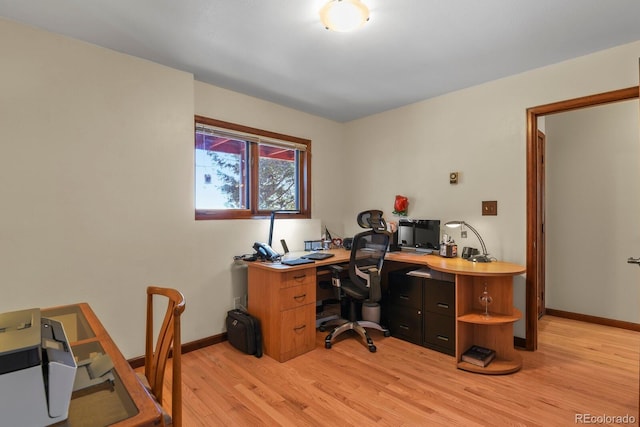 home office with light wood-type flooring