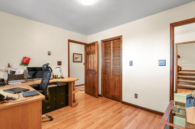 office with light hardwood / wood-style floors