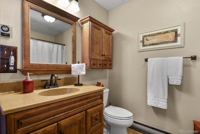 bathroom with vanity, a baseboard radiator, and toilet