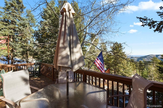 wooden terrace featuring a mountain view