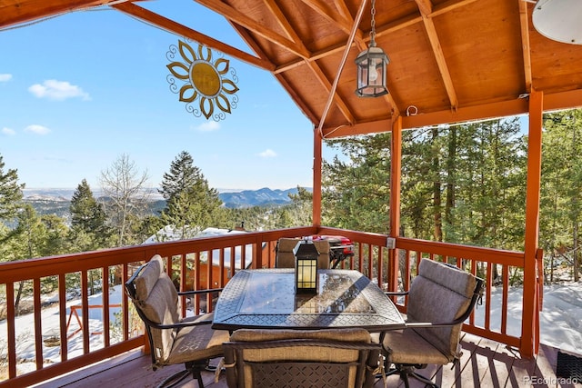 deck featuring a mountain view and a grill