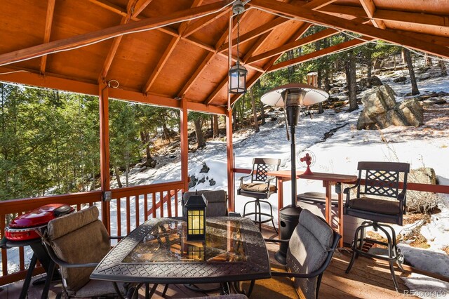 snow covered deck with a gazebo