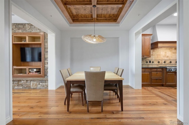 4364 Chateau Ridge Ln, Castle Rock, CO 80108 - dining space with light wood-style flooring, a raised ceiling, built in features, and wooden ceiling