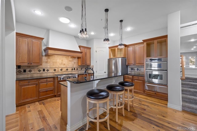 4364 Chateau Ridge Ln, Castle Rock, CO 80108 - kitchen with stainless steel appliances, a warming drawer, custom range hood, brown cabinets, and recessed lighting