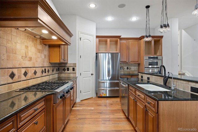 4364 Chateau Ridge Ln, Castle Rock, CO 80108 - kitchen featuring appliances with stainless steel finishes, custom exhaust hood, decorative backsplash, brown cabinets, and recessed lighting