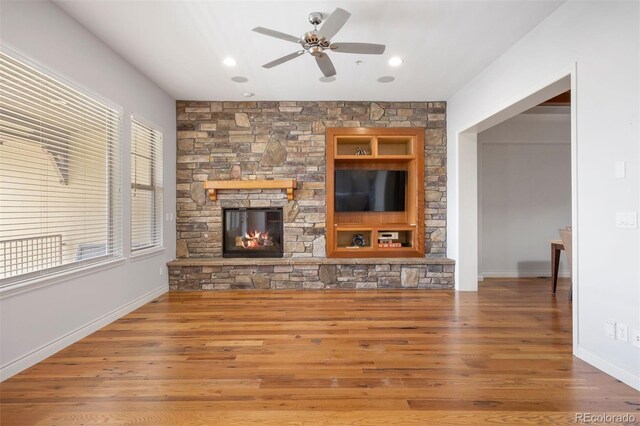 4364 Chateau Ridge Ln, Castle Rock, CO 80108 - unfurnished living room with ceiling fan, wood finished floors, a fireplace, and recessed lighting