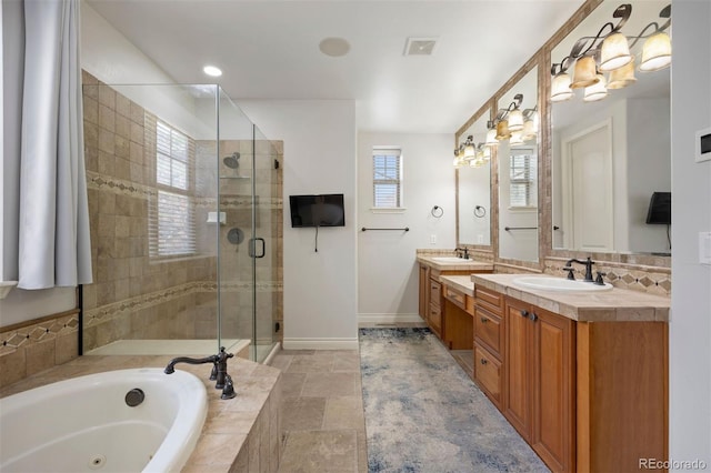 4364 Chateau Ridge Ln, Castle Rock, CO 80108 - full bathroom featuring a jetted tub, vanity, a stall shower, tasteful backsplash, and stone finish flooring