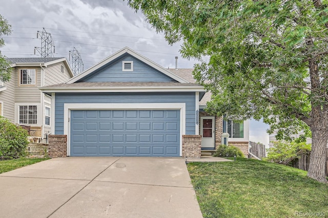 view of front facade featuring a shingled roof, concrete driveway, an attached garage, a front lawn, and brick siding