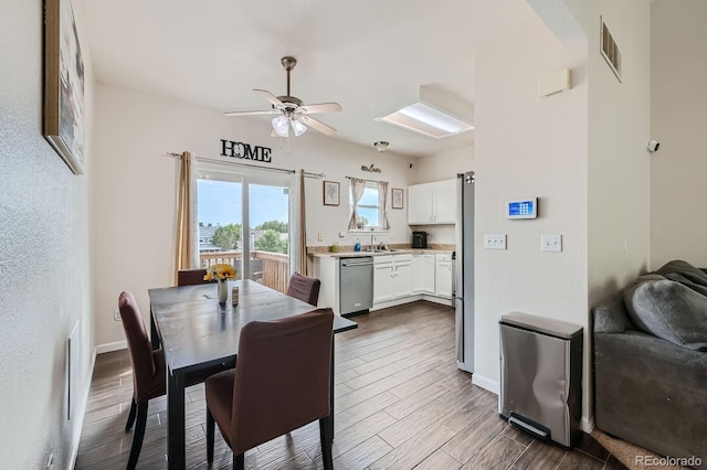 dining space featuring ceiling fan, dark wood-type flooring, visible vents, and baseboards