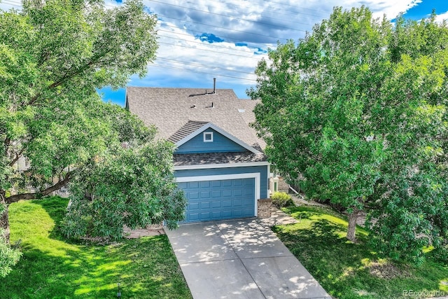 view of front of home with brick siding, a shingled roof, a front yard, a garage, and driveway