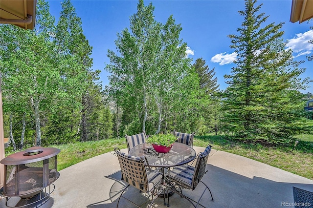 153 Gold Run Trl, Idaho Springs, CO 80452 - view of patio featuring outdoor dining space and a fire pit