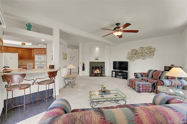 153 Gold Run Trl, Idaho Springs, CO 80452 - carpeted living area with ceiling fan and a tile fireplace