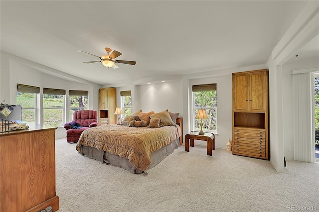153 Gold Run Trl, Idaho Springs, CO 80452 - bedroom featuring light colored carpet, multiple windows, a ceiling fan, and vaulted ceiling