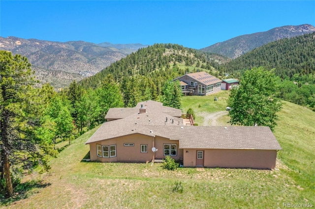 153 Gold Run Trl, Idaho Springs, CO 80452 - view of subject property with mountains and a heavily wooded area