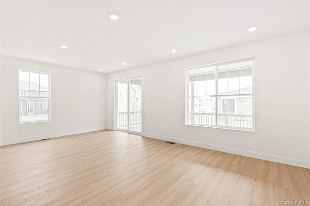20590 E 58th Ave, Aurora, CO 80019 - spare room with light wood-style floors, baseboards, and recessed lighting
