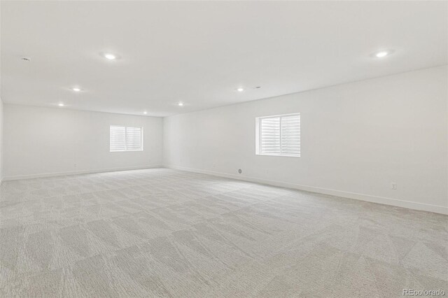 20590 E 58th Ave, Aurora, CO 80019 - unfurnished room with recessed lighting, light colored carpet, and baseboards