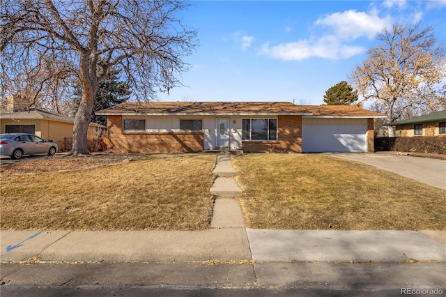 ranch-style house featuring a garage and a front yard