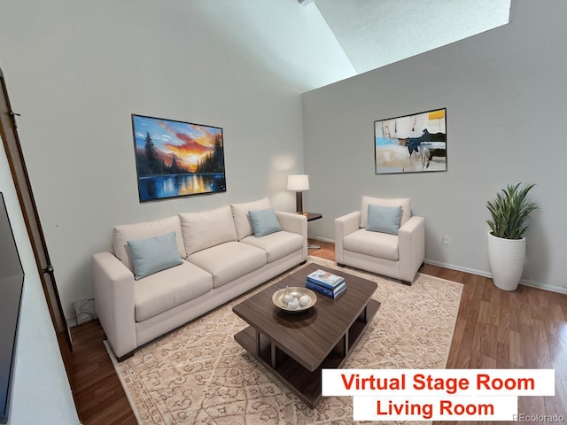 6921 S Bryant St, Littleton, CO 80120 - living room with wood finished floors, vaulted ceiling, and baseboards
