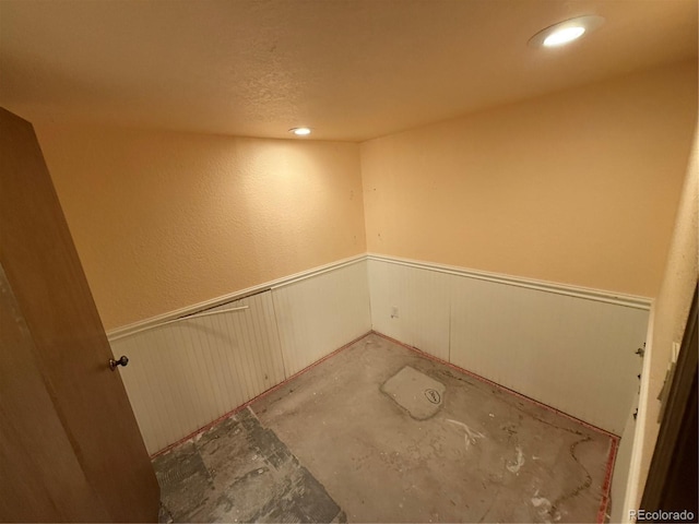 6921 S Bryant St, Littleton, CO 80120 - spare room featuring wainscoting and recessed lighting
