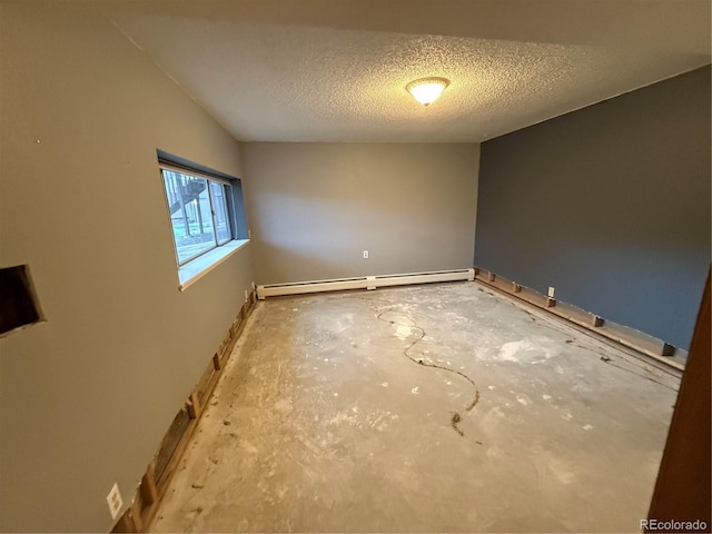 6921 S Bryant St, Littleton, CO 80120 - empty room featuring a baseboard heating unit, baseboards, and a textured ceiling
