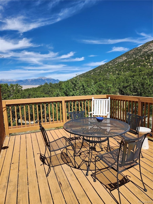 wooden terrace with a mountain view