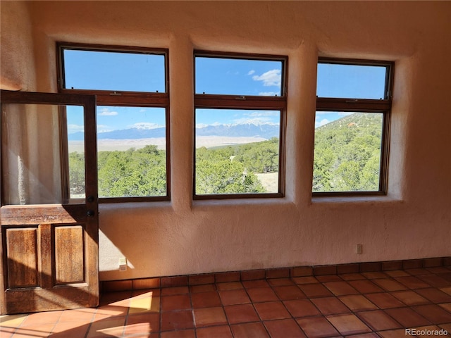 unfurnished sunroom featuring a healthy amount of sunlight