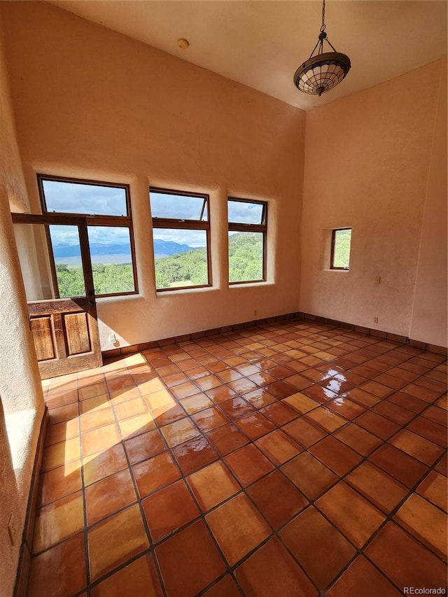 empty room with tile patterned flooring