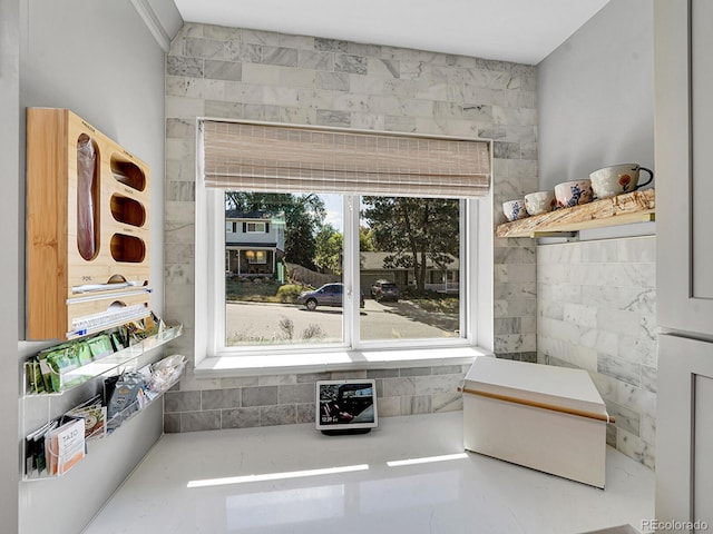 interior space featuring tile walls