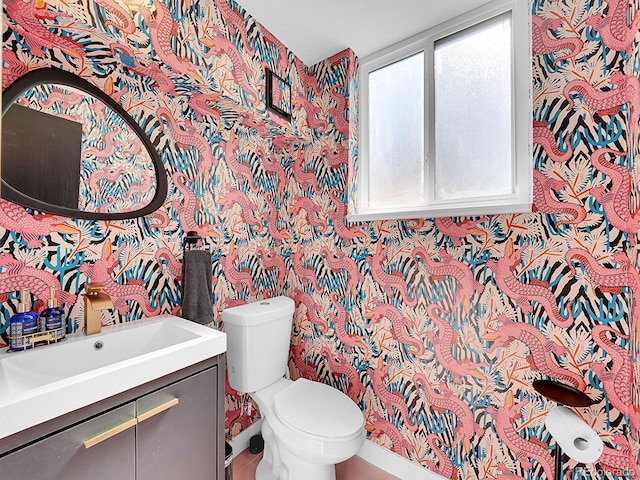 bathroom with vanity and toilet