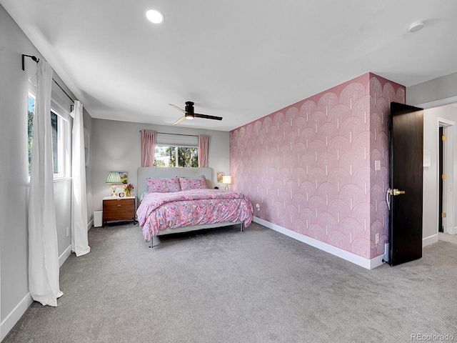 carpeted bedroom with ceiling fan