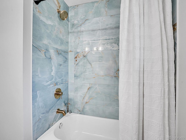 bathroom featuring shower / bathtub combination with curtain