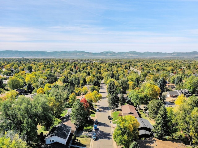 birds eye view of property with a mountain view