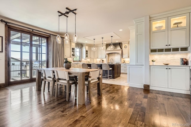 dining area with recessed lighting and dark wood-style flooring