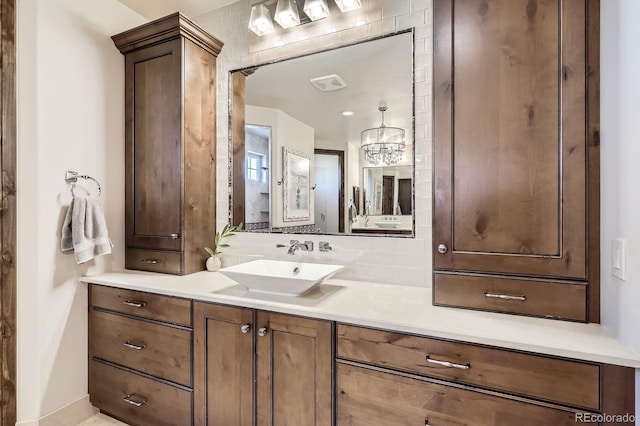 bathroom with vanity and visible vents