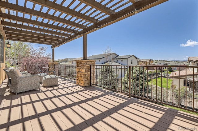 wooden deck with a pergola and a residential view