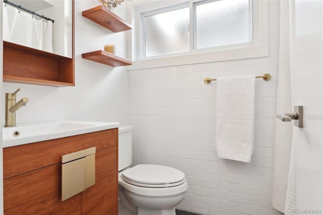 full bath with toilet and vanity