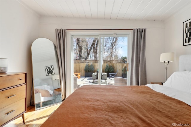 bedroom with access to exterior, wood ceiling, and light wood-style floors