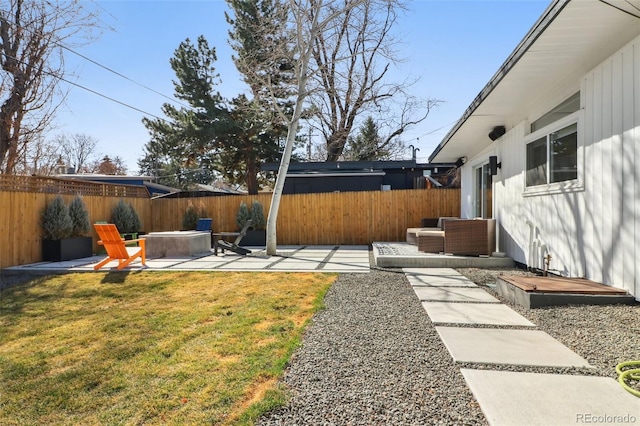 view of yard with a patio, fence private yard, and an outdoor living space