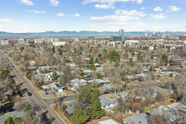 drone / aerial view featuring a city view and a mountain view