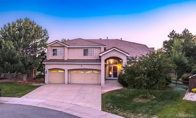 10085 Charissglen Ct, Highlands Ranch, CO 80126 - view of front of property with a garage, stucco siding, concrete driveway, and a tiled roof